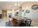 Open concept dining area connecting kitchen and living spaces at 4466 N 200Th Ln, Litchfield Park, AZ 85340