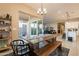 Dining area with a view into the kitchen and backyard at 4466 N 200Th Ln, Litchfield Park, AZ 85340