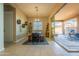 Dining room with wooden table and access to patio at 4466 N 200Th Ln, Litchfield Park, AZ 85340