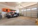 Spacious garage with golf cart, bikes, and kayak storage at 4466 N 200Th Ln, Litchfield Park, AZ 85340