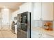 Spacious kitchen with white cabinets, stainless steel appliances, and large island at 4466 N 200Th Ln, Litchfield Park, AZ 85340