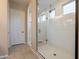 Large walk-in shower with glass enclosure and tile surround at 4466 N 200Th Ln, Litchfield Park, AZ 85340