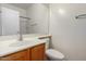 Simple bathroom with a single vanity and a mirrored medicine cabinet at 44899 W Portabello Rd, Maricopa, AZ 85139