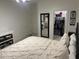 Comfortable bedroom with a queen bed and a walk-in closet at 44899 W Portabello Rd, Maricopa, AZ 85139