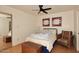 Cozy bedroom with ceiling fan and built-in storage at 5100 N Miller Rd # 20, Scottsdale, AZ 85250