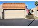 Attached garage with a Spanish-style tile roof at 5100 N Miller Rd # 20, Scottsdale, AZ 85250