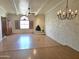 Spacious living room with hardwood floors, stylish lighting fixture and a unique fireplace at 5100 N Miller Rd # 20, Scottsdale, AZ 85250