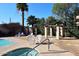 Community spa and pool with patio furniture and shade structures at 5100 N Miller Rd # 20, Scottsdale, AZ 85250