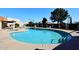 Community pool and spa with surrounding lounge chairs and patio area at 5100 N Miller Rd # 20, Scottsdale, AZ 85250