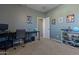 Bedroom with a desk, shelving and closet at 5227 W Desperado Way, Phoenix, AZ 85083