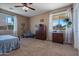 Comfortable bedroom with carpeted floors and ample natural light at 5227 W Desperado Way, Phoenix, AZ 85083