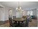 Dining area with dark wood table and chandelier at 5227 W Desperado Way, Phoenix, AZ 85083