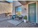 Inviting front patio with seating area and decorative rug at 5227 W Desperado Way, Phoenix, AZ 85083