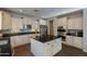 Modern kitchen with island, double ovens, and granite countertops at 5227 W Desperado Way, Phoenix, AZ 85083