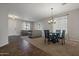 Open living and dining area with neutral color scheme and tile floors at 5227 W Desperado Way, Phoenix, AZ 85083