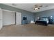 Spacious main bedroom with large window and ceiling fan at 5227 W Desperado Way, Phoenix, AZ 85083