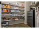 Well-organized pantry with ample shelving for storage at 5227 W Desperado Way, Phoenix, AZ 85083