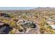 View of a home and neighborhood in a desert environment with mountains in the distance at 5655 N Camelback Canyon Dr, Phoenix, AZ 85018