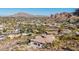 An aerial view of a beautiful home, highlighting its desert landscaping and stunning mountain surroundings at 5655 N Camelback Canyon Dr, Phoenix, AZ 85018