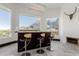 Interior home bar space with three stools, modern lighting, and views of mountains at 5655 N Camelback Canyon Dr, Phoenix, AZ 85018