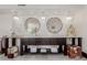 Elegant bathroom with dual sinks, crystal chandeliers, and decorative stools provides a luxurious feel at 5655 N Camelback Canyon Dr, Phoenix, AZ 85018