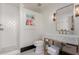 Stylish bathroom with white seashell patterned tile in the shower and elegant decor at 5655 N Camelback Canyon Dr, Phoenix, AZ 85018