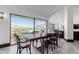 Bright dining room features mountain views from expansive windows, and an elegant table for entertaining at 5655 N Camelback Canyon Dr, Phoenix, AZ 85018