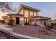 Exterior facade of a modern home featuring a covered patio with outdoor furniture at 5655 N Camelback Canyon Dr, Phoenix, AZ 85018