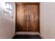 Elegant double door entry with textured walls and modern lighting at 5655 N Camelback Canyon Dr, Phoenix, AZ 85018