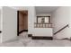 Hallway featuring an elevator and a decorative wood feature looking into another room at 5655 N Camelback Canyon Dr, Phoenix, AZ 85018