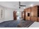 Spacious main bedroom with hardwood built-ins and double doors leading to a view at 5655 N Camelback Canyon Dr, Phoenix, AZ 85018