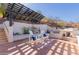 Outdoor grill and seating area perfect for entertaining guests with custom pergola at 5655 N Camelback Canyon Dr, Phoenix, AZ 85018