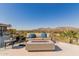 Relaxing outdoor patio features a comfortable seating area with fire pit and mountain views at 5655 N Camelback Canyon Dr, Phoenix, AZ 85018