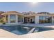 Backyard pool area includes a pool, fountain, and large glass doors to the living area at 5655 N Camelback Canyon Dr, Phoenix, AZ 85018