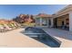 Backyard pool area includes a pool, fountain, and lounge chairs with mountain views at 5655 N Camelback Canyon Dr, Phoenix, AZ 85018