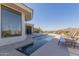 Backyard pool area includes a pool, fountain, and lounge chairs with mountain views at 5655 N Camelback Canyon Dr, Phoenix, AZ 85018