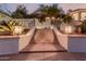 Exterior staircase with mosaic tile risers, leading to a landscaped property at 5655 N Camelback Canyon Dr, Phoenix, AZ 85018