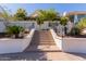 Exterior staircase with mosaic tile risers, leading to a landscaped property at 5655 N Camelback Canyon Dr, Phoenix, AZ 85018