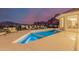 A luxurious swimming pool with city views and stylish lounge furniture at 5655 N Camelback Canyon Dr, Phoenix, AZ 85018