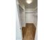 Walk-in closet with wood-look floors and built-in shelving at 5712 N 63Rd Ave, Glendale, AZ 85301