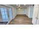 Spacious dining area with wood-look floors and French doors at 5712 N 63Rd Ave, Glendale, AZ 85301