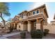 Two-story house with a light brown exterior and a blue front door at 5856 E Hampton Ave, Mesa, AZ 85206