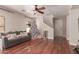 Living room with hardwood floors, a Christmas tree, and a comfy couch at 5856 E Hampton Ave, Mesa, AZ 85206