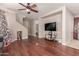 Bright living room with hardwood floors and a view of the staircase at 5856 E Hampton Ave, Mesa, AZ 85206