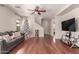 Living room with hardwood floors, Christmas tree and comfortable couch at 5856 E Hampton Ave, Mesa, AZ 85206