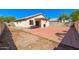 Sun-drenched backyard with a large patio area, perfect for relaxation at 603 W Sierra Vista Dr, Apache Junction, AZ 85120