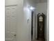 Hallway with a grandfather clock and light fixture at 603 W Sierra Vista Dr, Apache Junction, AZ 85120