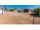 Mobile home backyard with gravel and partial fence at 630 S 93Rd Pl, Mesa, AZ 85208