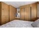 Bedroom with built-in dresser and sliding door closet at 630 S 93Rd Pl, Mesa, AZ 85208