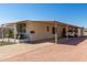 Single-wide manufactured home with carport and desert landscaping at 630 S 93Rd Pl, Mesa, AZ 85208